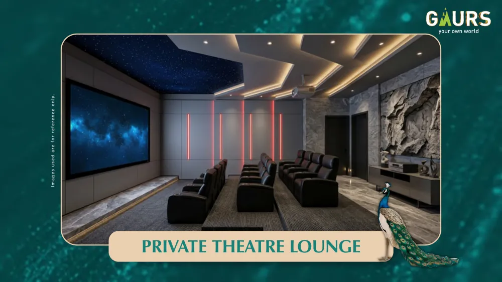 Private theatre lounge at Gaur Alaris clubhouse with tiered seating and full-wall screen, captioned Private Theatre Lounge